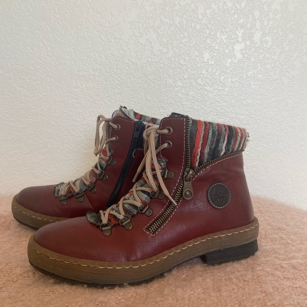 Reiner leather boots, lined insides. Barely worn. Red and black detail on ankle.